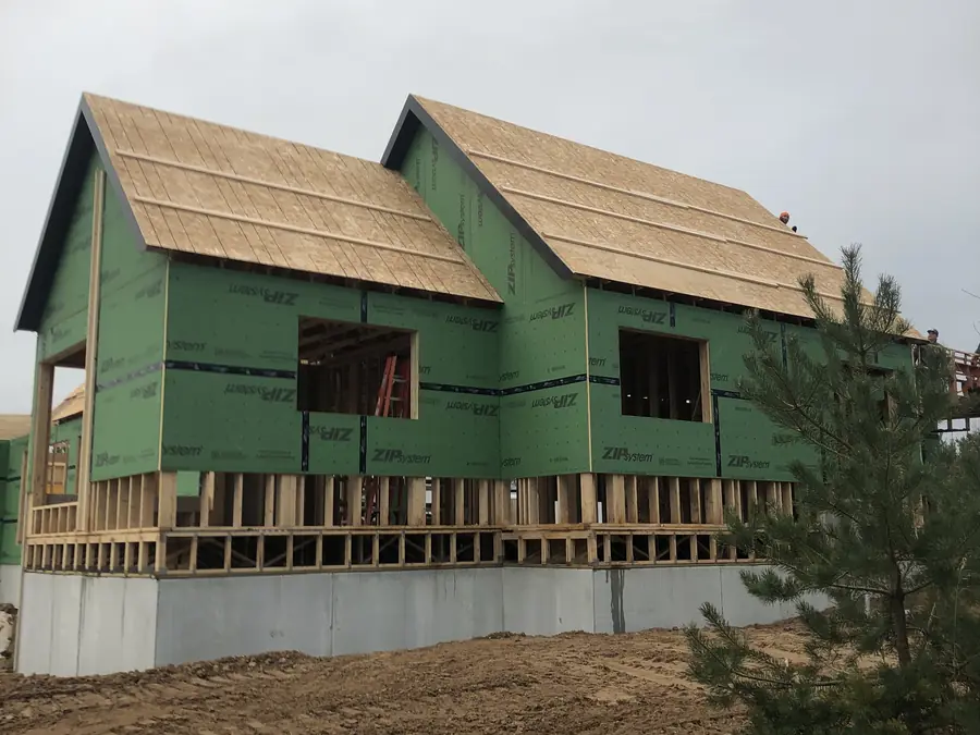 New construction home with roof decks ready for roofing